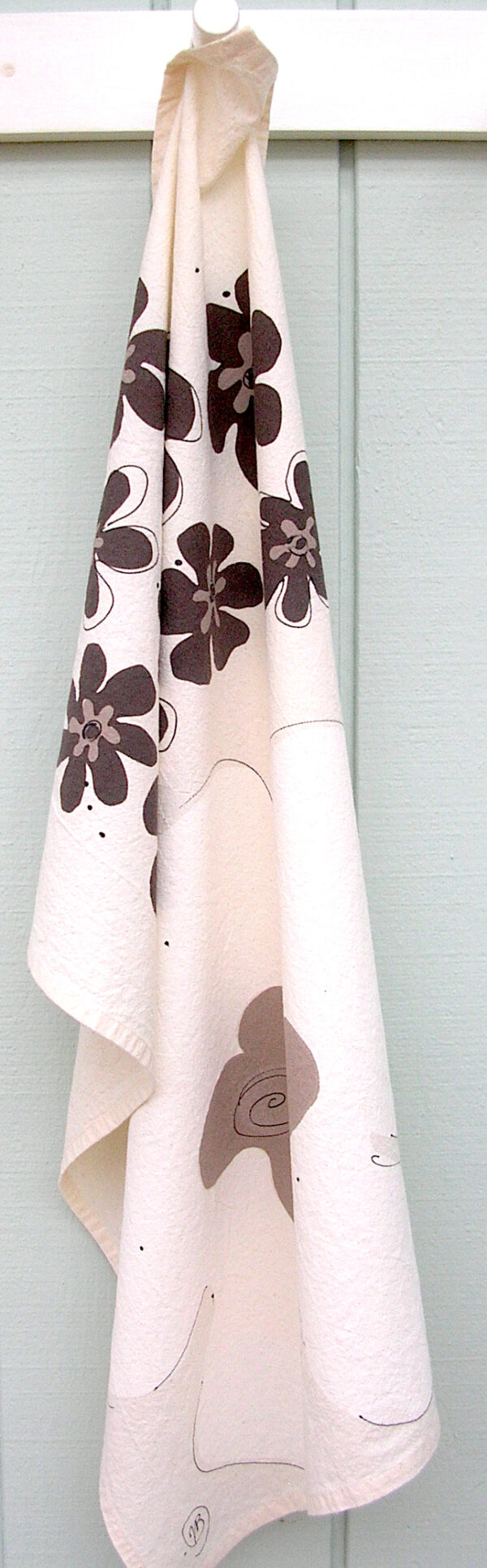 Coffee Cream kitchen towel on a natural background.